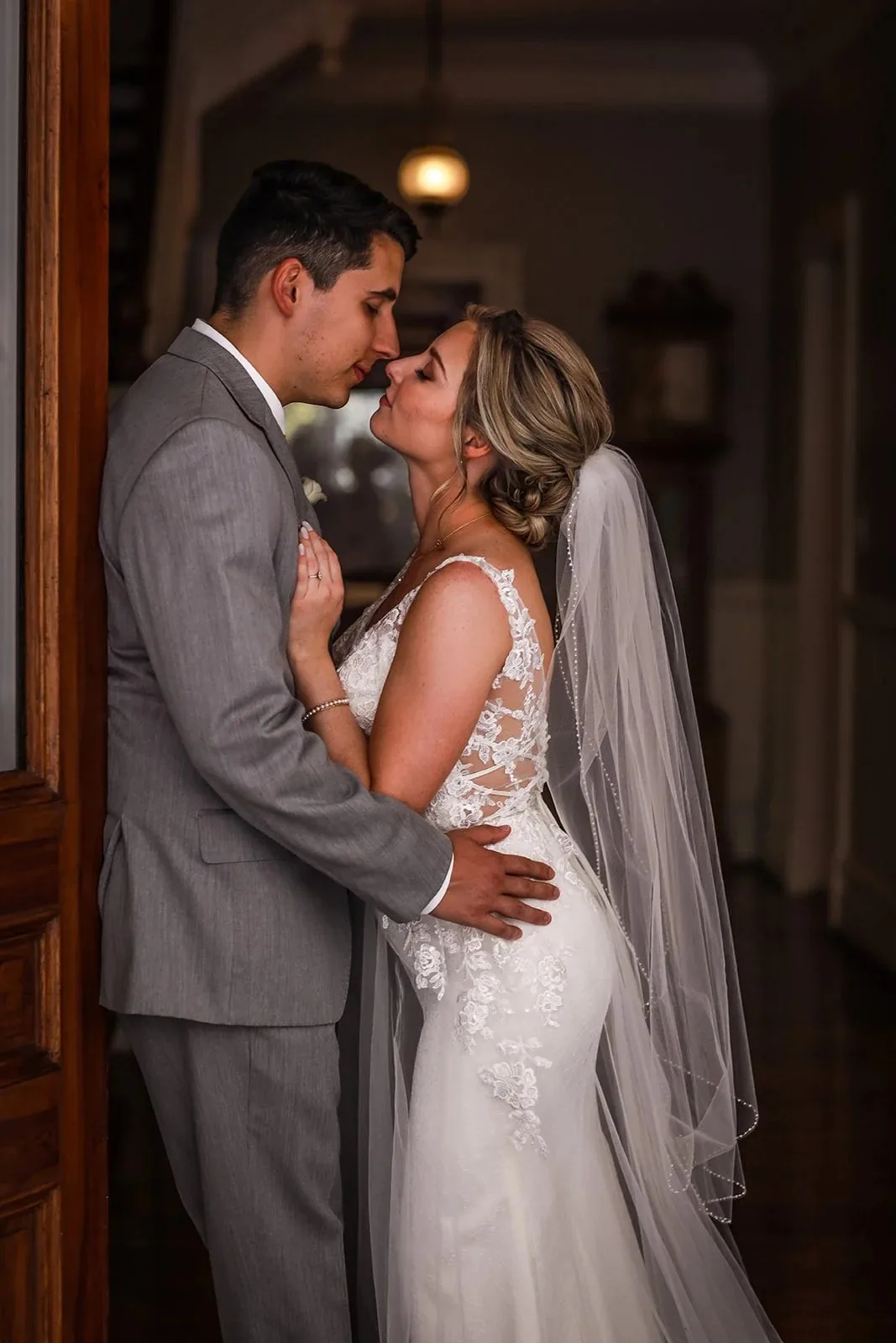 Newlyweds sharing a quiet kiss after their ceremony